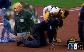 Umpire C.B. Bucknor golpeado por un batazo de foul (FOTO: Especial)